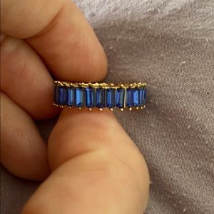 Blue gemstone (looks like sapphires) ring.
